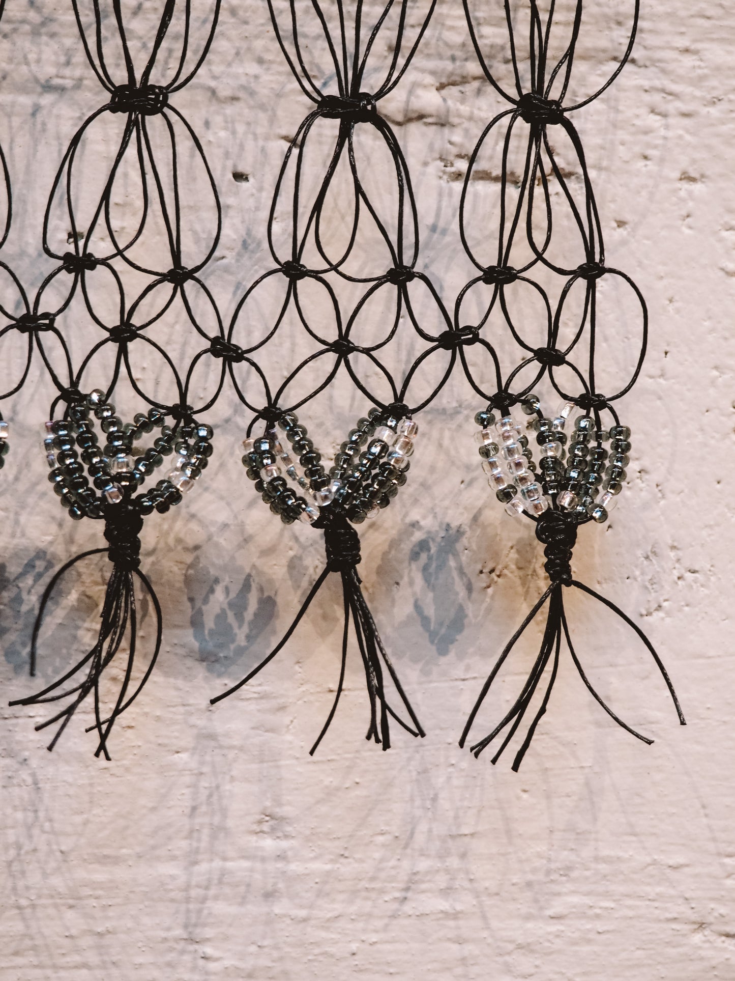 Black Beaded on Driftwood