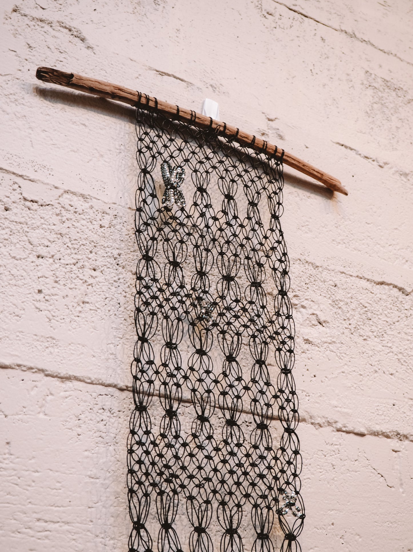 Black Beaded on Driftwood