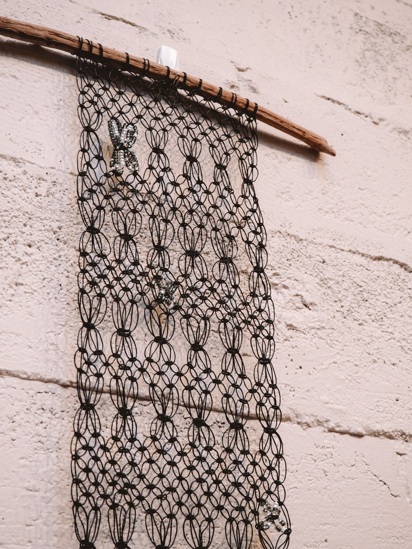 Black Beaded on Driftwood